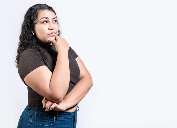 stock image Thoughtful people with hand on chin. Latin girl wondering with hand on chin isolated