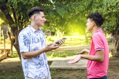 young man chatting with young man, two people arguing WITH COPY SPACE