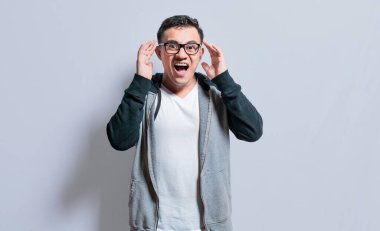 Surprised people opening his mouth, Surprised people with dumbfounded face on isolated background, astonished man holding his head