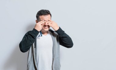 Person with visual fatigue isolated, Man with glasses with visual fatigue, concept of person with asthenopia, Person with glasses with visual pain