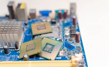 Close up of a motherboard, details of a computer motherboard, detail of a motherboard socket, three processors on a computer motherboard