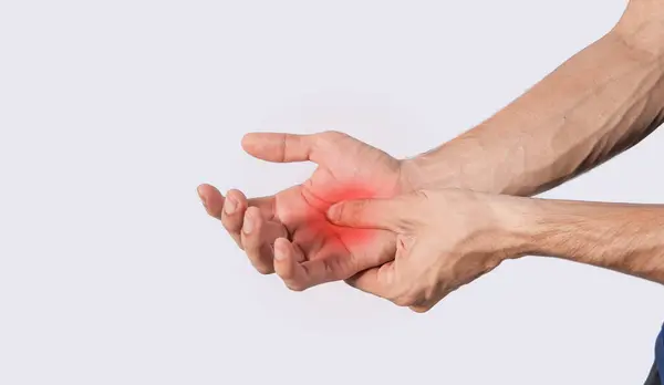 stock image Person with palm pain, concept of a man with pain in the hands, man with arthritis rubbing, person with pain in the hands