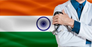 Hindistan bayrağında steteskoplu bir doktor. Hindistan bayrağında steteskop tutan doktor.