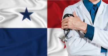 Panama bayrağında steteskoplu bir doktor. Panama bayrağında steteskop tutan doktor.