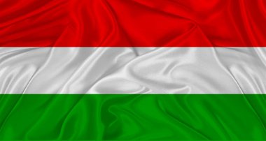 Kumaş desenli Macar bayrağı. Macaristan 'ın gerçekçi bayrağı dalgalanıyor