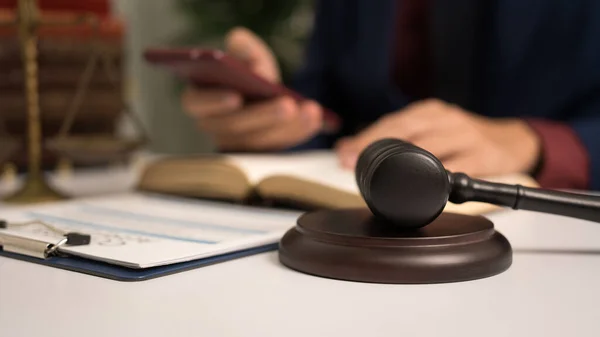 stock image Male lawyer working with law book, A legal binding, Unilateral contract, Multilateral, Non-reciprocal contract, Default, Obligation, Power of attorney, Defense of a prescription, Court decree