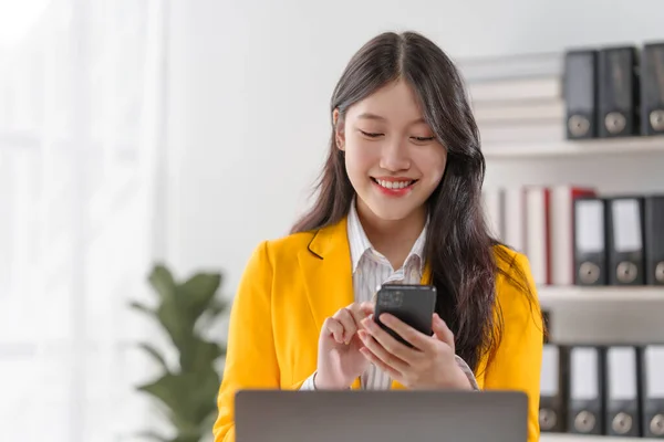 Female loan service providers asian people business professionals ensuring easy loan processes, working diligently, guiding clients through financial pathways, and mapping success.