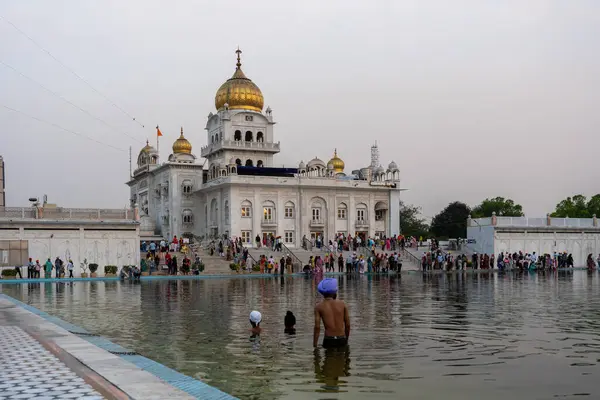 stock image New Delhi, India - March 30, 2024: Exterior view of Gurudwara Bangla Sahib, a famous Sikh house of worship.