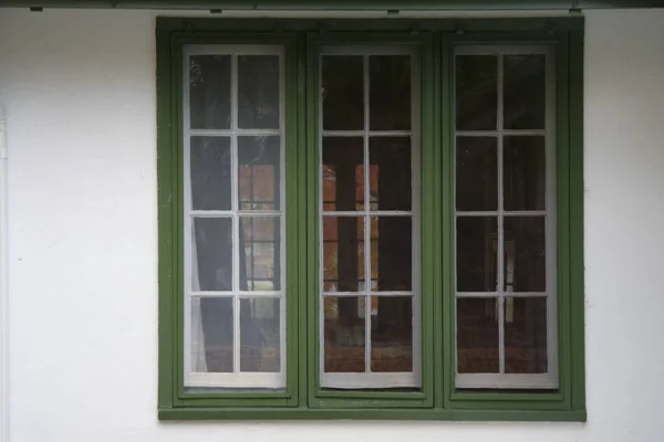 Windows Green Trim White Building — Stock Photo, Image