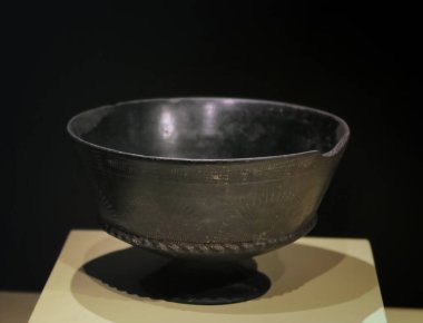 Ancient Etruscan cup from central southern Italy, dated between the 6th and 7th centuries BC,called Kantharos and made of bucchero (black ceramic)