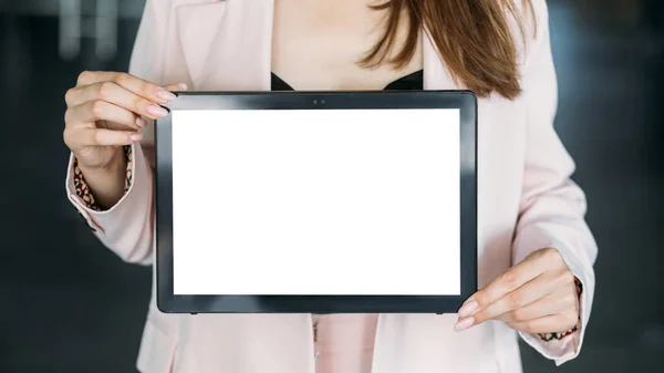 stock image Digital mockup. Online technology. Advertising background. Unrecognizable woman holding tablet computer blank screen in light room interior.