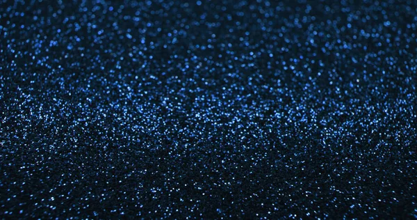 ボケの光の背景 ブラーの輝きのテクスチャ ファンタジーグレア 暗い黒の抽象的なフリースペースポスターに青の光沢のある輝きの反射 — ストック写真