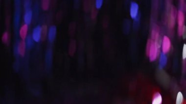 Festive multicolor bokeh flickering. Abstract Christmas lights background motion
