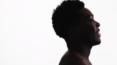 Male profile. Smiling face. Positive thinking. Side view portrait of relaxed pleased man isolated on white empty space background.