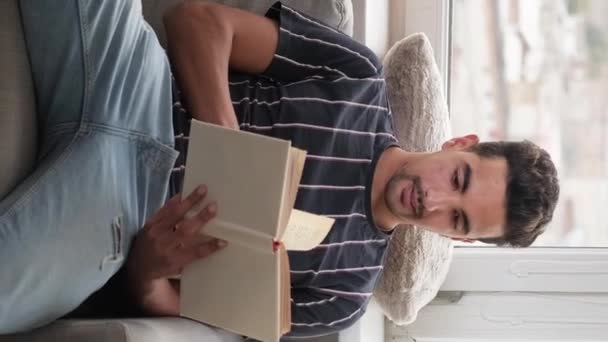 Vertical Video Weekend Leisure Relaxed Man Enjoying Reading Handsome Casual — Stockvideo