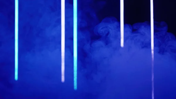 Color smoke background. Blur glow. Futuristic illumination. Defocused blue neon laser light vapor cloud on dark abstract free space.