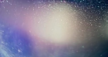 Bokeh sparkles texture. Firework sparks. Glitter light. Blur blue orange color glow shiny particles lens flare abstract transition overlay background. Shot on RED Cinema camera.