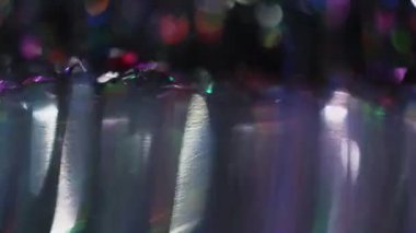 Valentines day background. Defocused shiny tinsel. Lens flare motion. Blurred bokeh lights