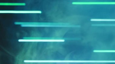 Neon background. Blur light. Laser illumination. Defocused luminous green color lines glow smoke floating on dark abstract free space.