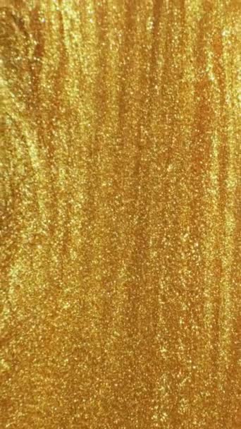 Vertical Video Shiny Fluid Molten Gold Ink Flow Defocused Sparkling — Video