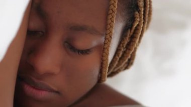 Vertical video. Sleep rest. Morning nap. Sweet dreams. Weekend relaxation. Closeup of peaceful woman face with closed eyes in bed on cozy soft white pillow.