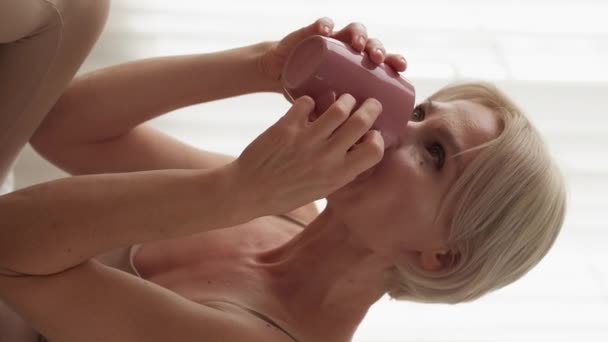 Vertical Video Good Morning Relaxed Woman Enjoying Drink Dreamful Smiling — Stock video