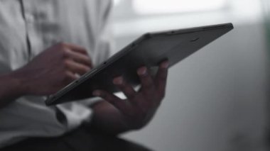 Digital marketing. Online research. Information technology. Unrecognizable business man hands using tablet working at virtual office.
