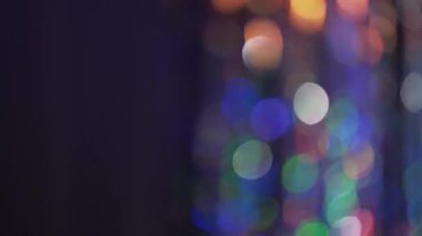 Festive multicolor bokeh. Abstract New Year background design pattern. Fairy lights curtain moving