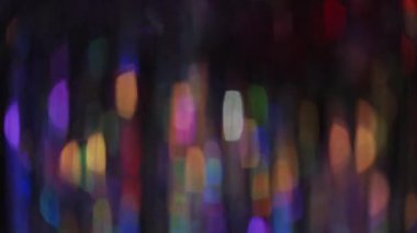Festive multicolor bokeh. Abstract New Year background design pattern. Fairy lights curtain moving