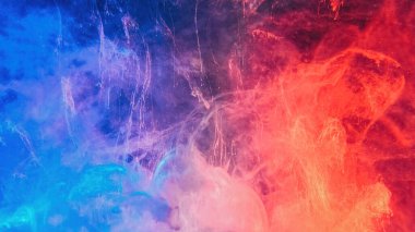 Color smoke abstract background. Cold hot. Ice fire flame. Defocused blue red contrast paint splash light glowing vapor floating cloud texture.