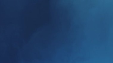 Blur color light. Neon smoke. LED beam. Defocused blue lines glow vapor floating motion on dark abstract free space futuristic background.