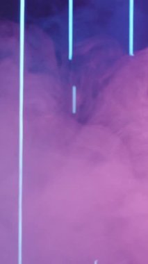 Vertical video. Color steam. Defocused neon light. Cyberpunk vapor. Blur UV pink blue purple glow fog cloud flow on dark abstract free space background.