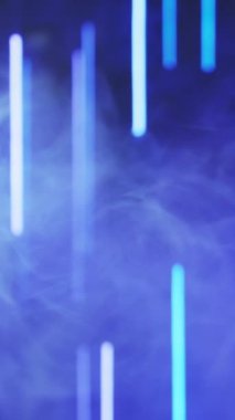 Vertical video. Neon background. Blur light. Laser illumination. Defocused blue color lines glow smoke floating on dark abstract free space.