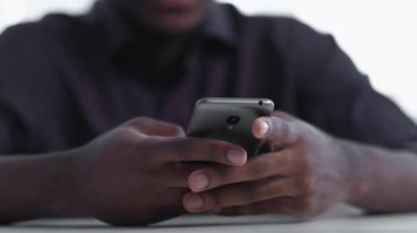 Mobile business. Digital marketing. Internet communication. Closeup of unrecognizable man hands using phone chatting texting message.