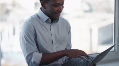 Freelance work. Online business. Modern technology. Relaxed cheerful confident CEO man typing using laptop at light office window.