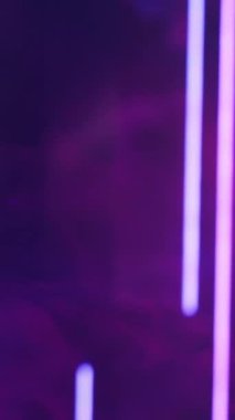 Vertical video. Color vapor. Neon light. Ultraviolet rays. Blur purple lines glow smoke flow on dark abstract free space presentation background.