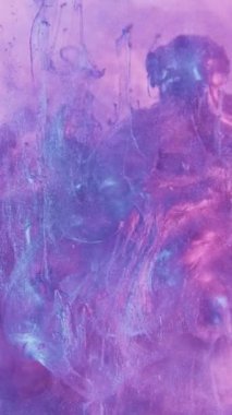 Vertical video. Glitter fluid paint splash. Steam texture. Purple blue neon color light sparkling paint shot motion fog cloud abstract background.