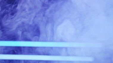 Neon smoke. Blur color light. Vapor flow. Defocused blue luminous glow steam floating on abstract free space futuristic background.