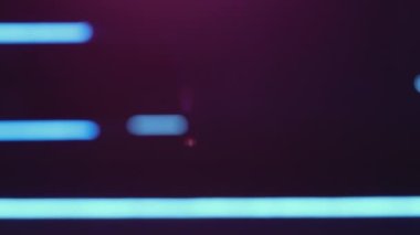Blur neon light. Lens flare. Defocused ultraviolet rays. Bokeh purple blue color glow lines on dark abstract free space background.