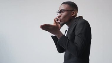 Business disagreement. Aggressive boss. Corporate conflict. Furious man executive arguing on phone call angry with work mistake on white copy space.