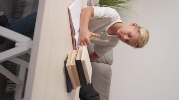 Vertical Video Home Study Satisfied Boy Homework Prepare Smiling Casual — Stock video