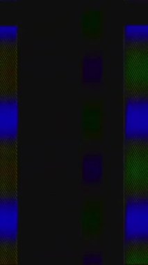 Vertical video. Color glitch analog distortion. Transition flicker. Blue green real VHS stripes noise artifacts on dark black abstract background.