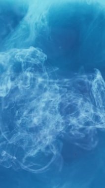 Vertical video. Paint water. Smoke cloud. Vapor flow. Sky haze. Blue white color steam floating spreading motion abstract art background shot on RED.
