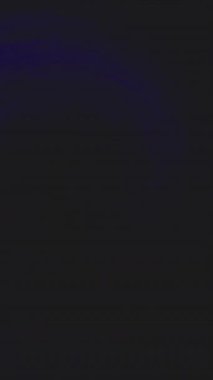 Vertical video. Neon light color swirl. Storm wave. Electric striking. Blue flicker flash glow whirl motion on dark black art abstract background shot on RED.