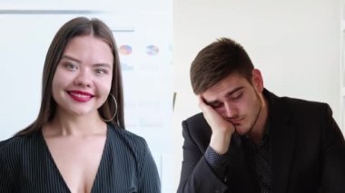 Video call. Boring interview. Business webinar. Confident female leader speaking to tired distracted male colleague online at virtual office.