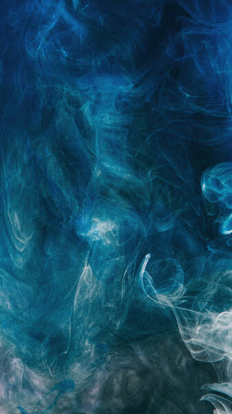 Smoke texture. Abstract background. Ink water. Enchanted air. Blue color gradient glowing dust particles fog cloud floating with copy space.