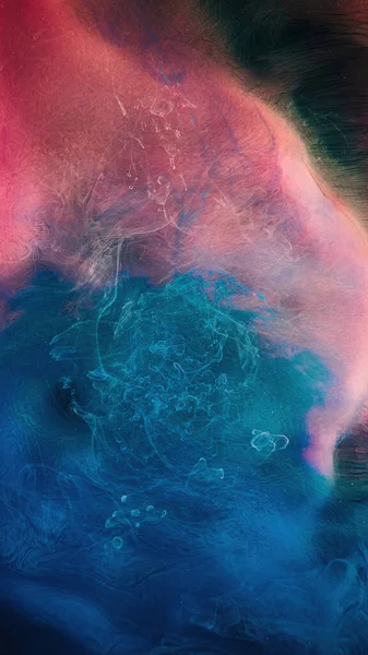 Color mist. Smoke cloud. Ink water mix. Underwater paint splash. Pink blue contrast color haze floating on black abstract background.
