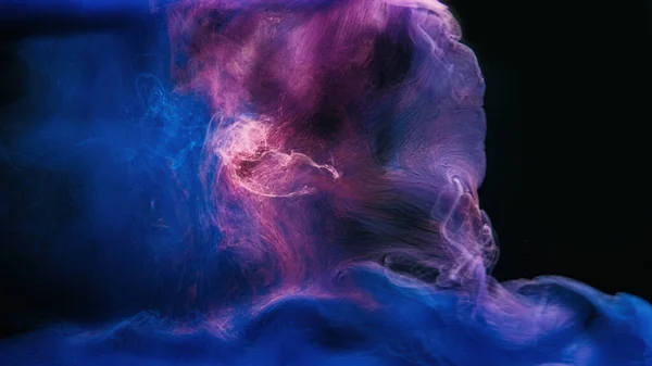 Color mist. Ink water. Haze floating. Magic spell explosion. Blue purple glowing smoke cloud wave on dark black abstract art background.