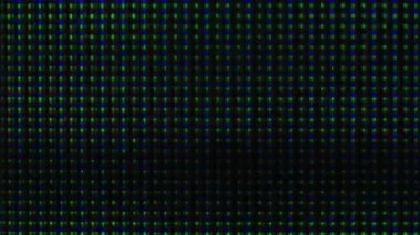 Arıza dokusu. Tahıl sesi. Ekran bozulması. Yeşil, pembe, parlayan pikselli, dijital objeler koyu siyah, soyut arka planda titreşiyor..