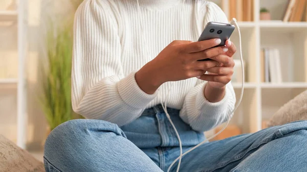 stock image Phone texting. Internet surfing. Mobile leisure. Millennial woman hands chatting on cellphone social media sitting light home room.